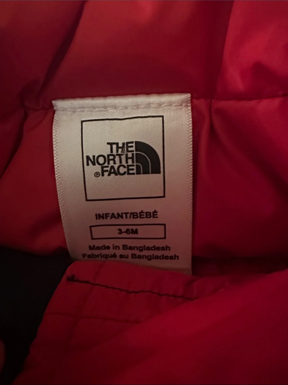 The North Face Navy Puffer Jacket with Red Accents